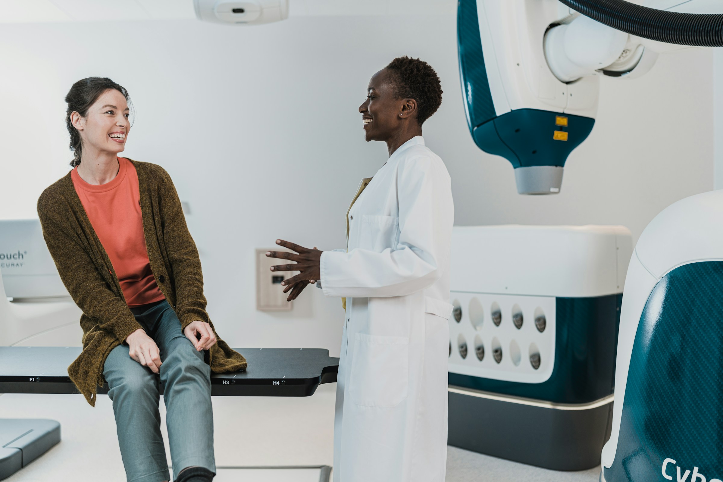 Patient and Doctor speaking. Photo by Accuray on Unsplash